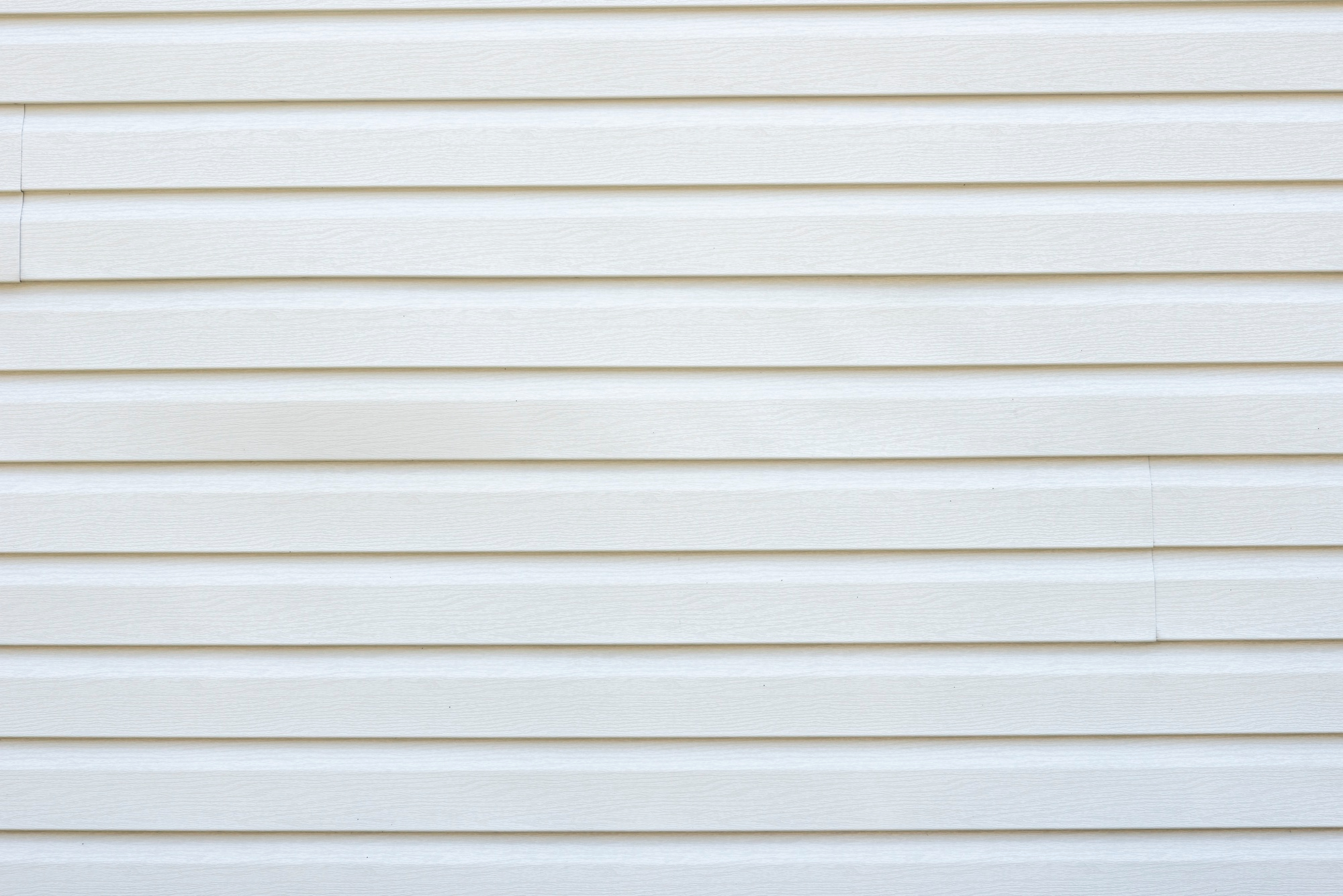 shiplap boards used as exterior cladding painted white